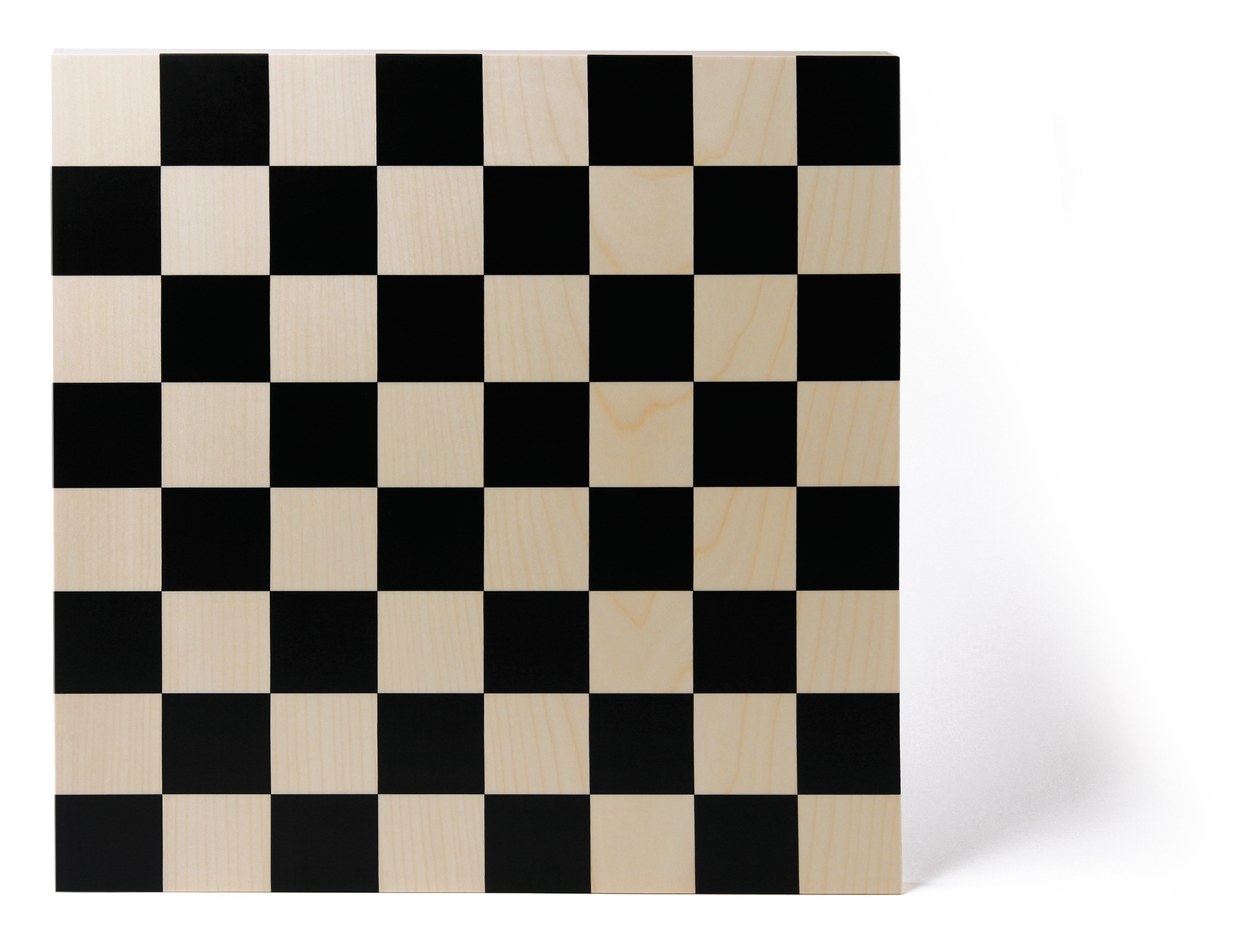 Naef Schachbrett im Bauhaus Design mit schwarzen und hellen Holzfeldern.