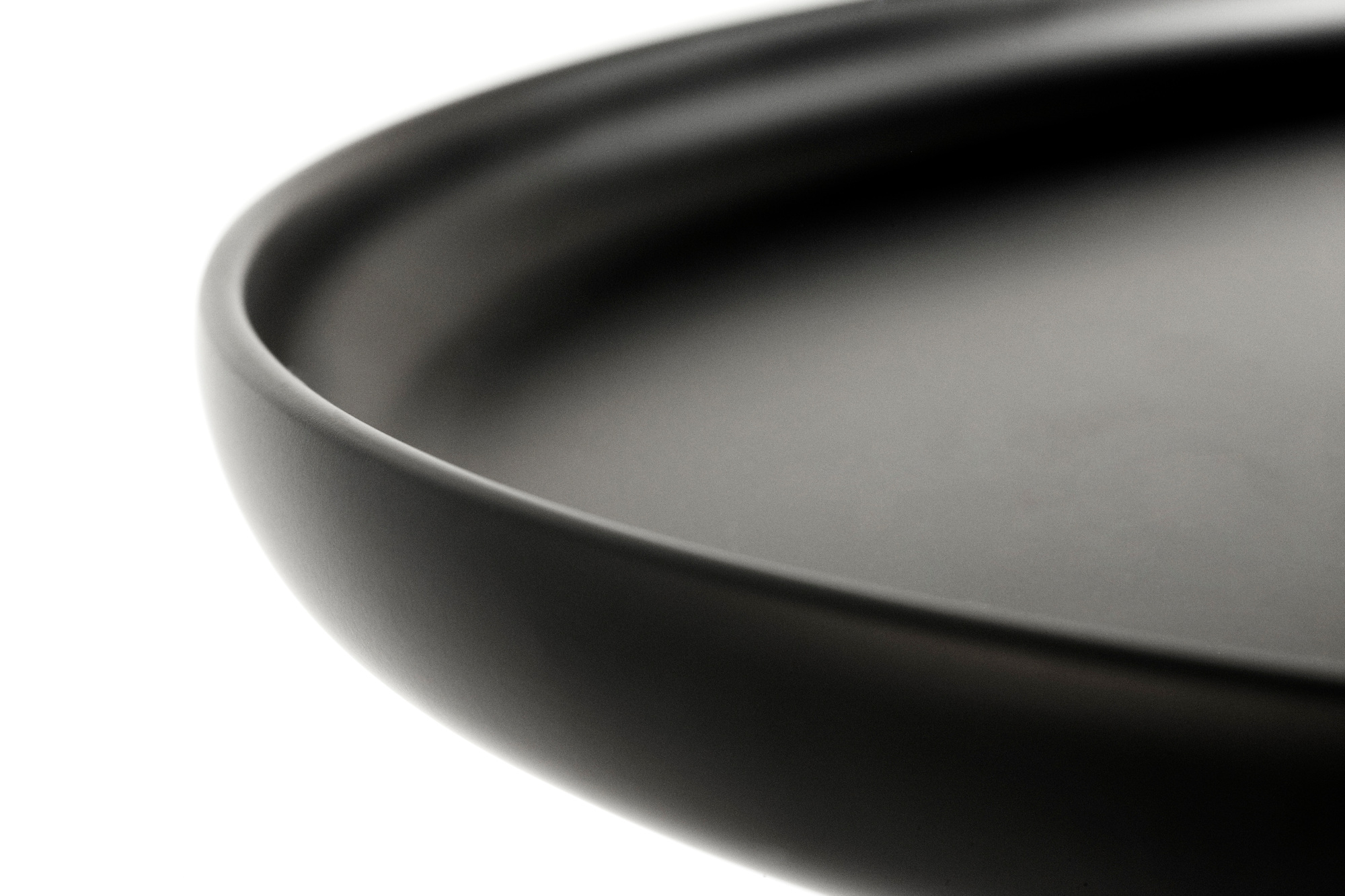 Detailaufnahme der Tischplatte des schwarzen Tablo Couchtisch von Normann Copenhagen. Modernes Design.