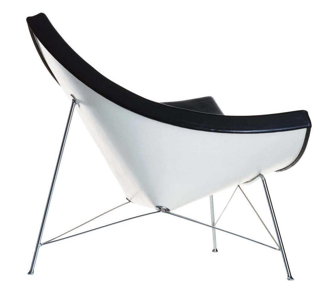 Vitra Coconut Chair, moderner Sessel mit weißer Sitzschale und schwarzer Polsterung auf filigranem Metallgestell.