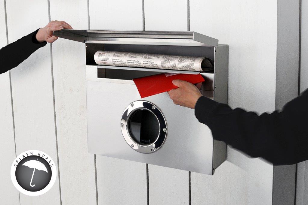 Moderner Edelstahl-Briefkasten mit Sichtfenster: Einwurf von rotem Brief und Zeitung durch Hände.