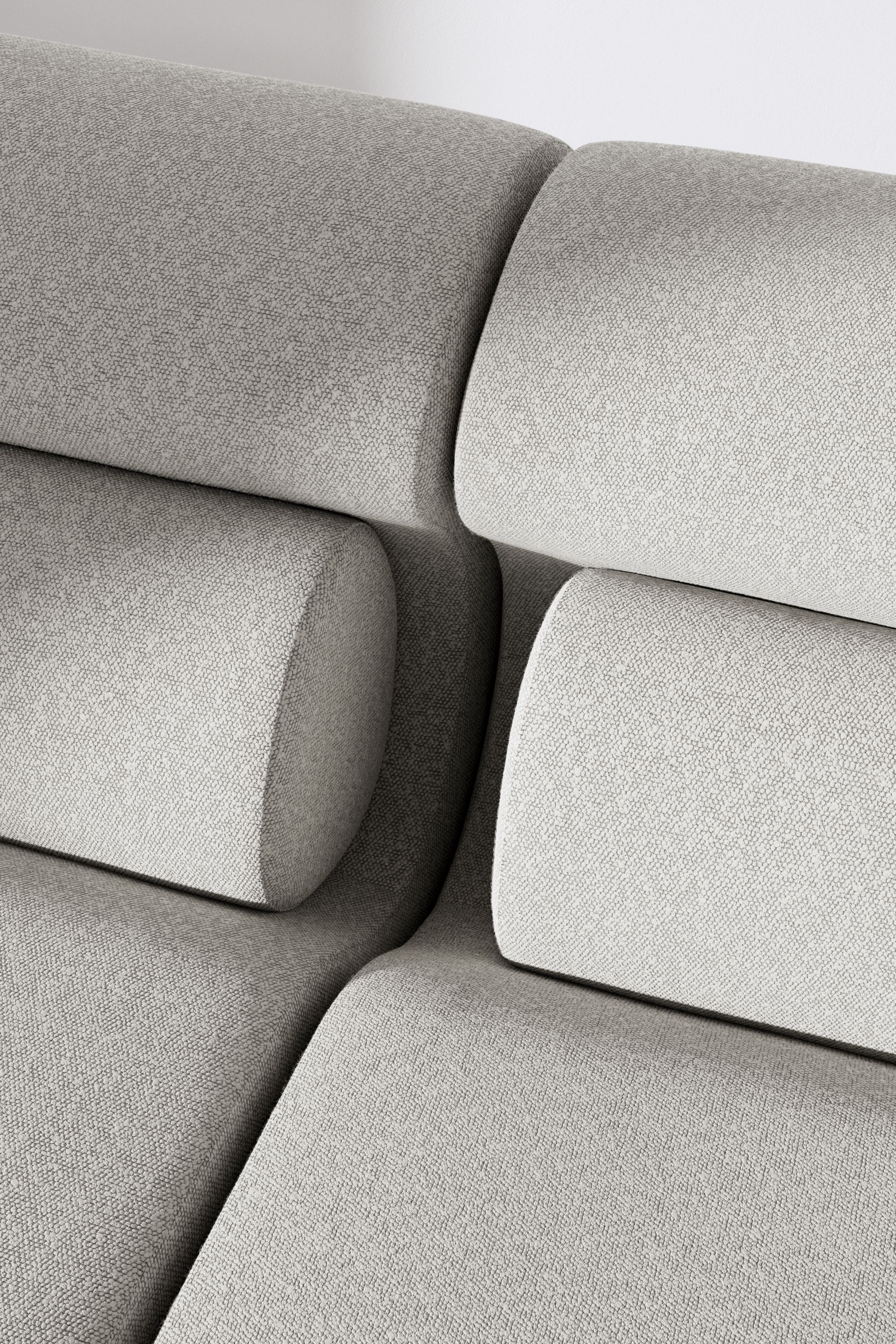 Detailaufnahme des OLA Sofa Pouf OUT in hellgrauem Stoff, modulare Sitzgelegenheit für Wohnzimmer und Lounge.