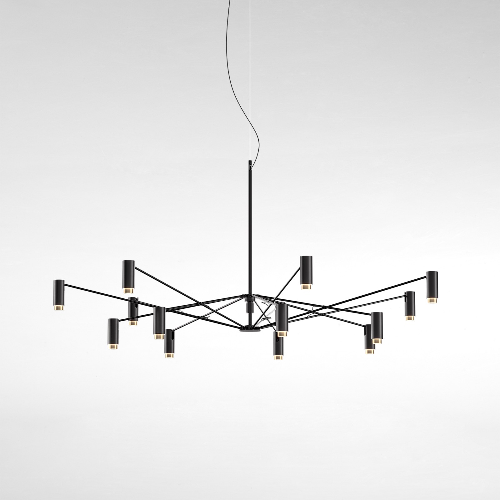 The W Pendelleuchte von Marset, moderne Hängelampe in Schwarz mit zylindrischen Leuchten und warmem Licht.