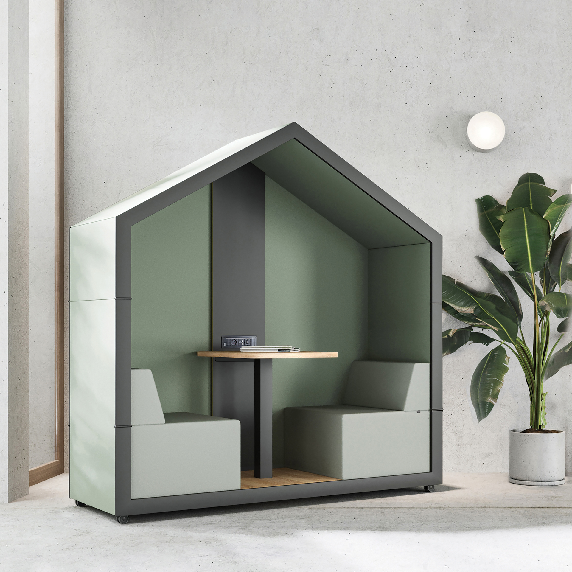 Bejot treehouse TH 2 Akustikkabine für zwei Personen mit Tisch und grüner Innenausstattung.
