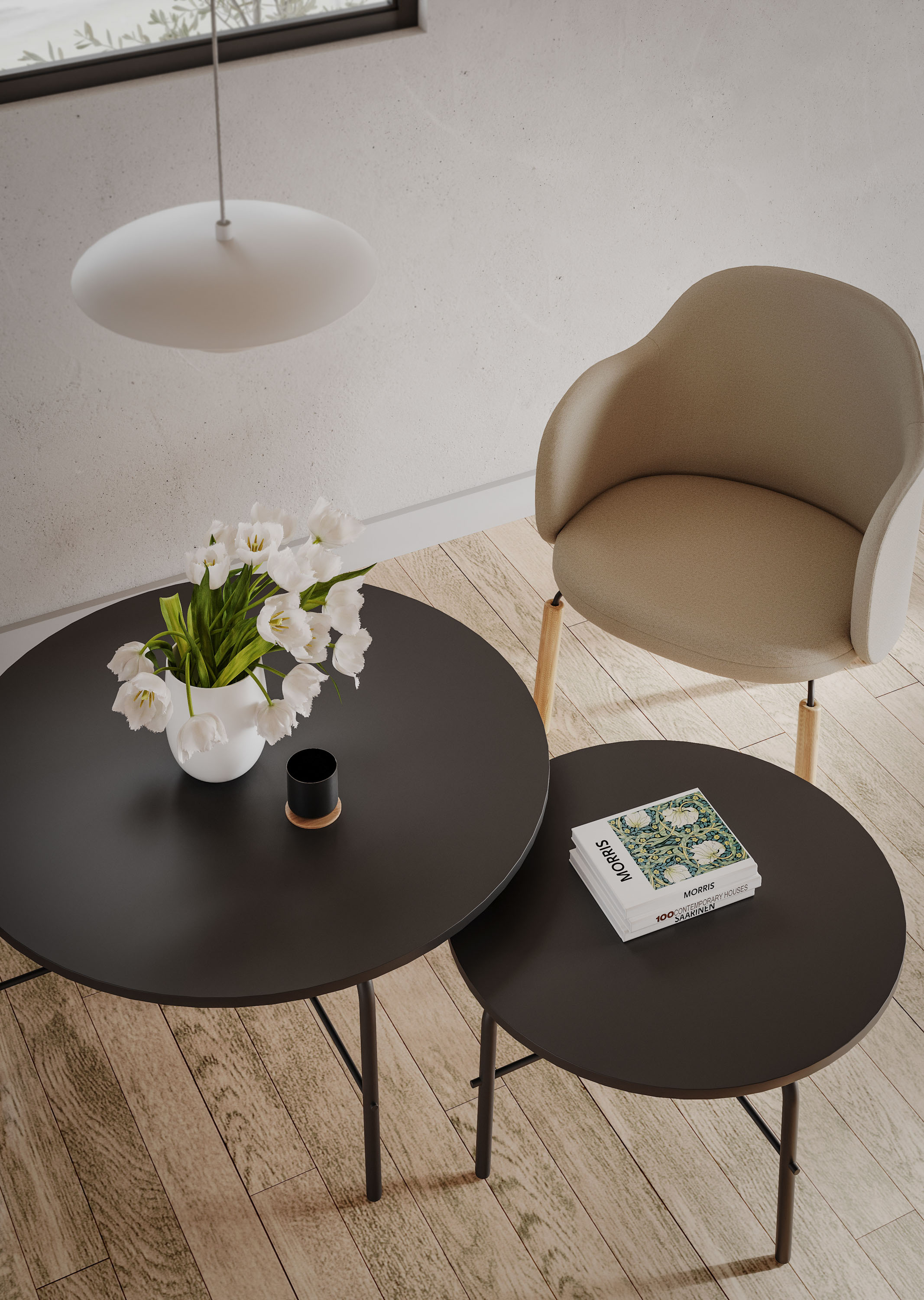 Moderner Couchtisch "flos FS TB RC L Bejot" in Schwarz mit Blumen und Buch auf Holzboden.