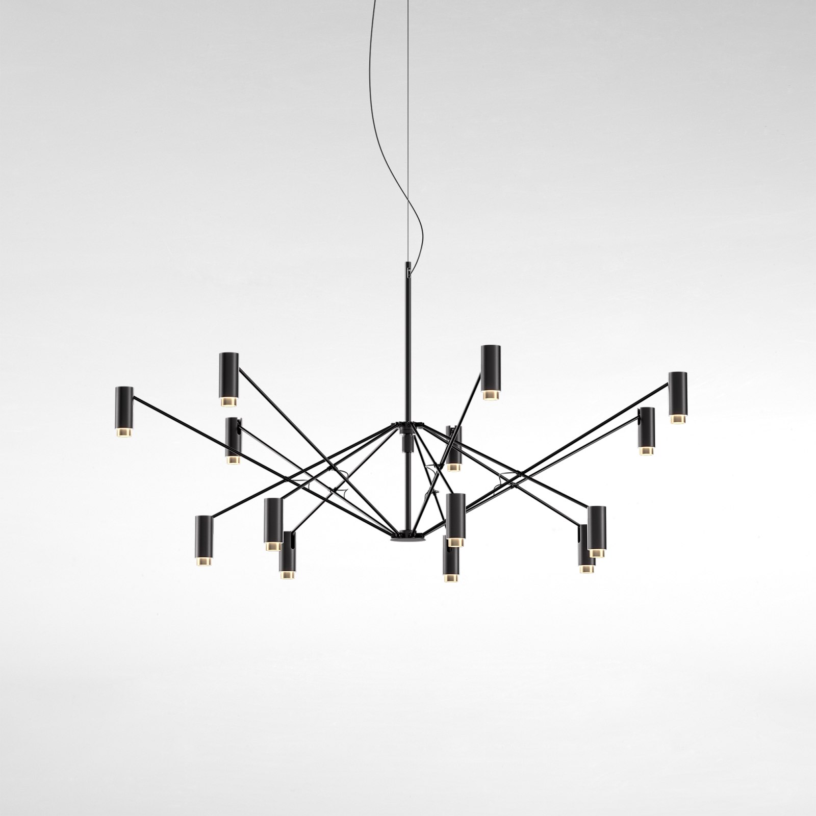 The W Pendelleuchte von Marset, moderne Hängelampe in Schwarz mit zylindrischen Leuchten und warmem Licht.