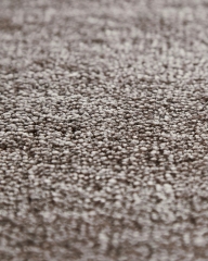 Detailaufnahme des braunen, gewebten Tint Rug Teppichs von Woud, ideal als Wohnzimmerteppich oder Schlafzimmerteppich.