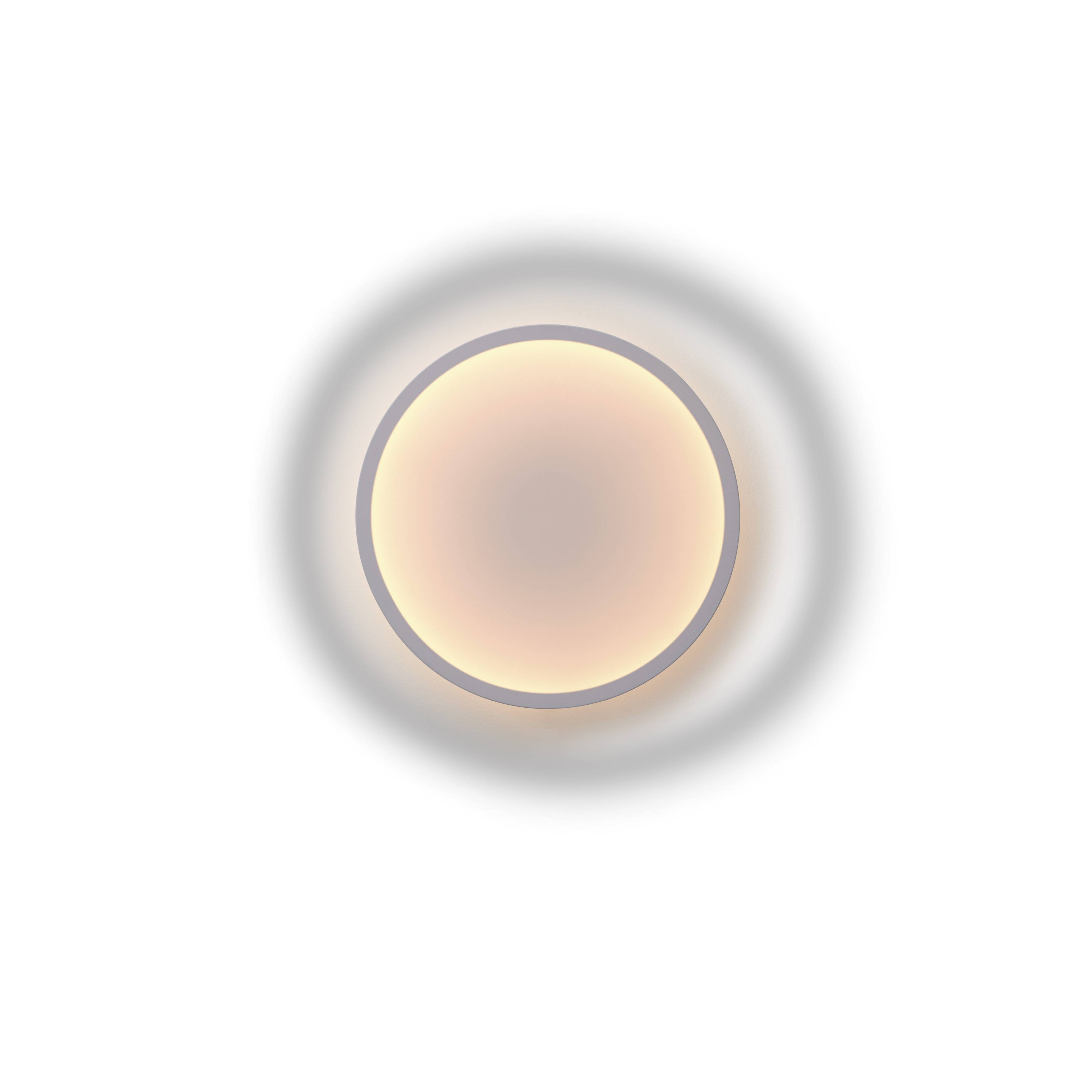 Nahaufnahme der runden Muuto Calm Wall Lamp Wandleuchte mit sanftem, warmem Licht.