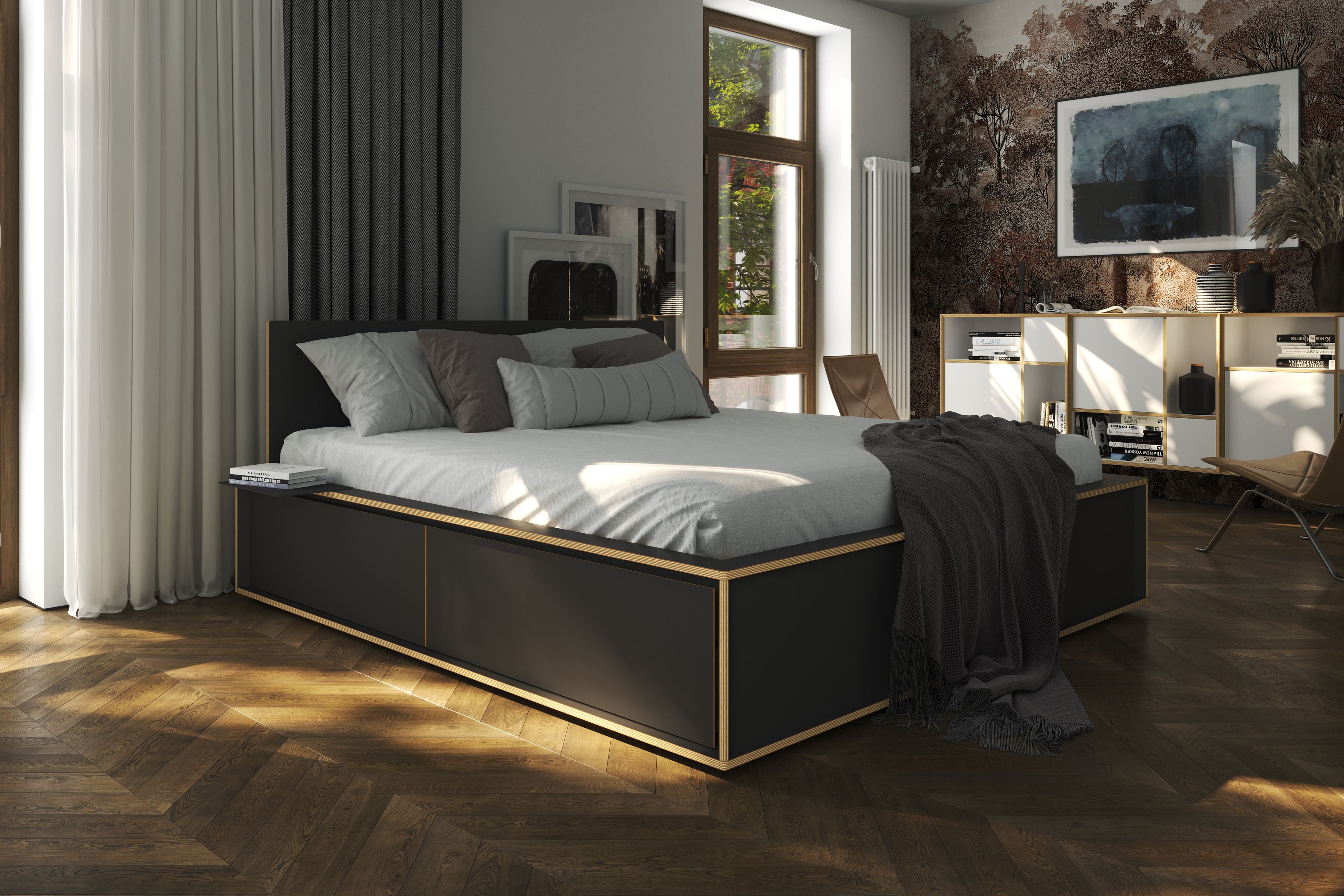 Schlafzimmer mit Spaze Bett von Müller Möbelwerkstätten, schwarzer Rahmen und Schubladen, helle Bettwäsche.