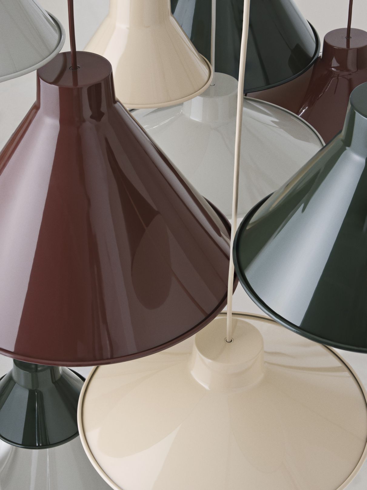 Nahaufnahme von mehreren Muuto Top Pendant Lamp Pendelleuchten in Grau, Braun, Beige und Grün.