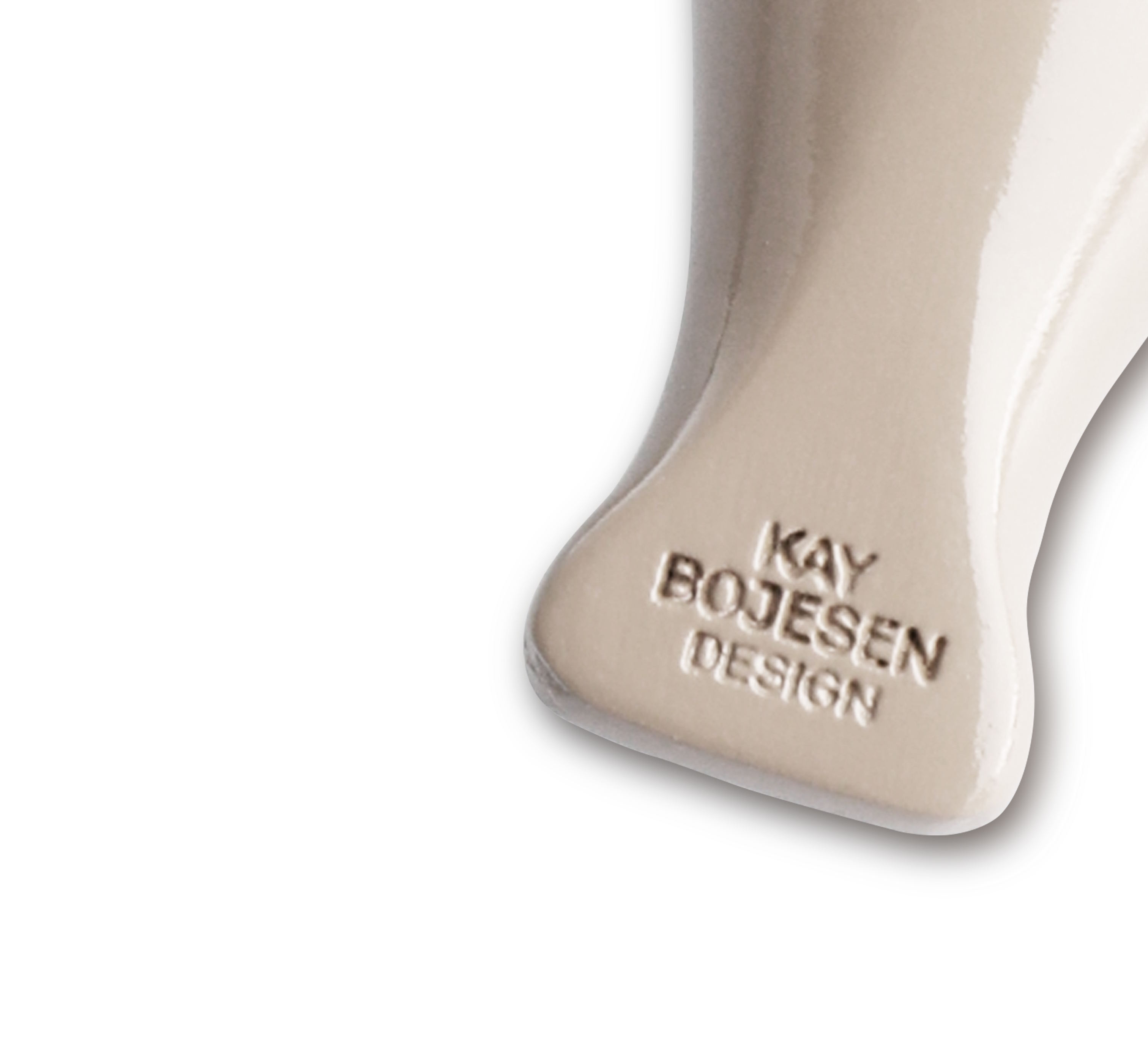 Sleutelhanger met vogelmotief in beige goudkleurig metaal met natuurlijk leer Kay Bojesen