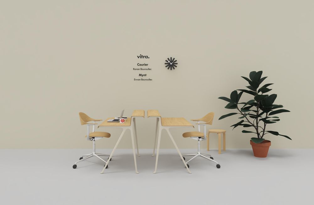 Vitra Mynt Bürodrehstühle aus Schichtholz mit Tisch in hellem, modernem Büroambiente mit Zimmerpflanze.