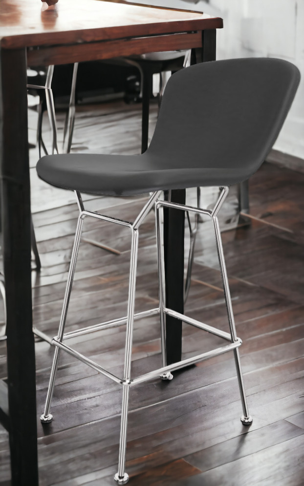 Bertoia Barhocker in Thekenhöhe mit schwarzem Kernlederbezug und verchromtem Stahlgestell von Knoll International.