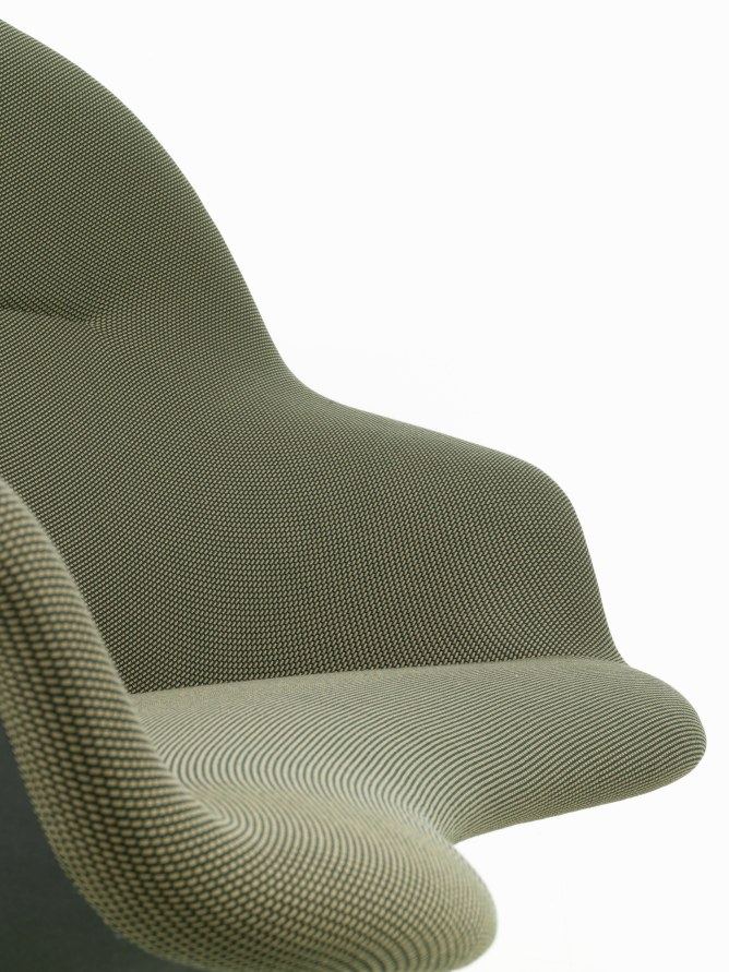 Detailaufnahme des Abalon Sofas von Vitra mit olivgrünem Stoffbezug und wellenförmiger Sitzfläche.