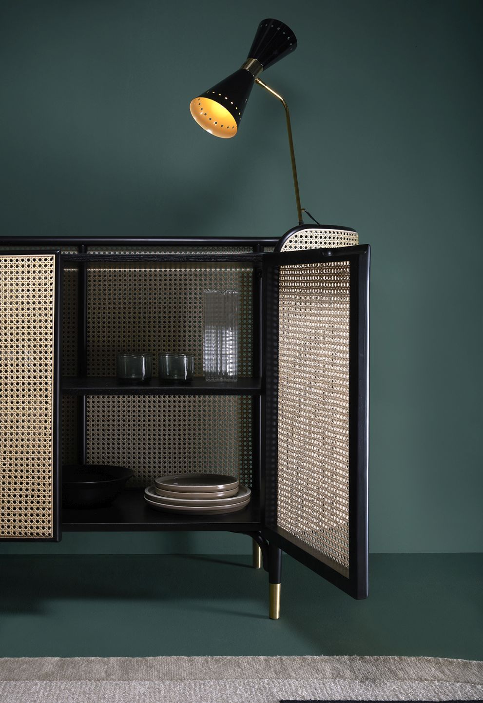 MOS CABINET Schrank von Wiener GTV Design mit offener Tür, Rattan Geflecht und Geschirr.
