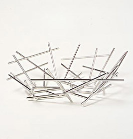 Alessi Blow Up Korbschale aus glänzendem Edelstahl, modernes Design für Obst und Dekoration.