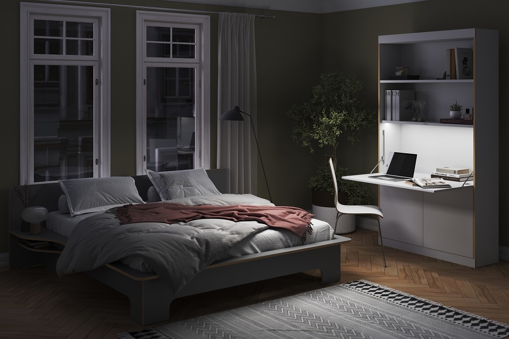FLAI Home-Office Sekretär von Müller Möbelwerkstätten im Schlafzimmer mit Bett, Schreibtisch und Regal.