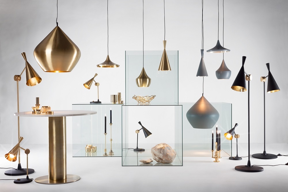 Produktfoto: Tom Dixon Beat Leuchten Kollektion mit Pendelleuchten und Stehlampen in Gold, Schwarz und Grau.