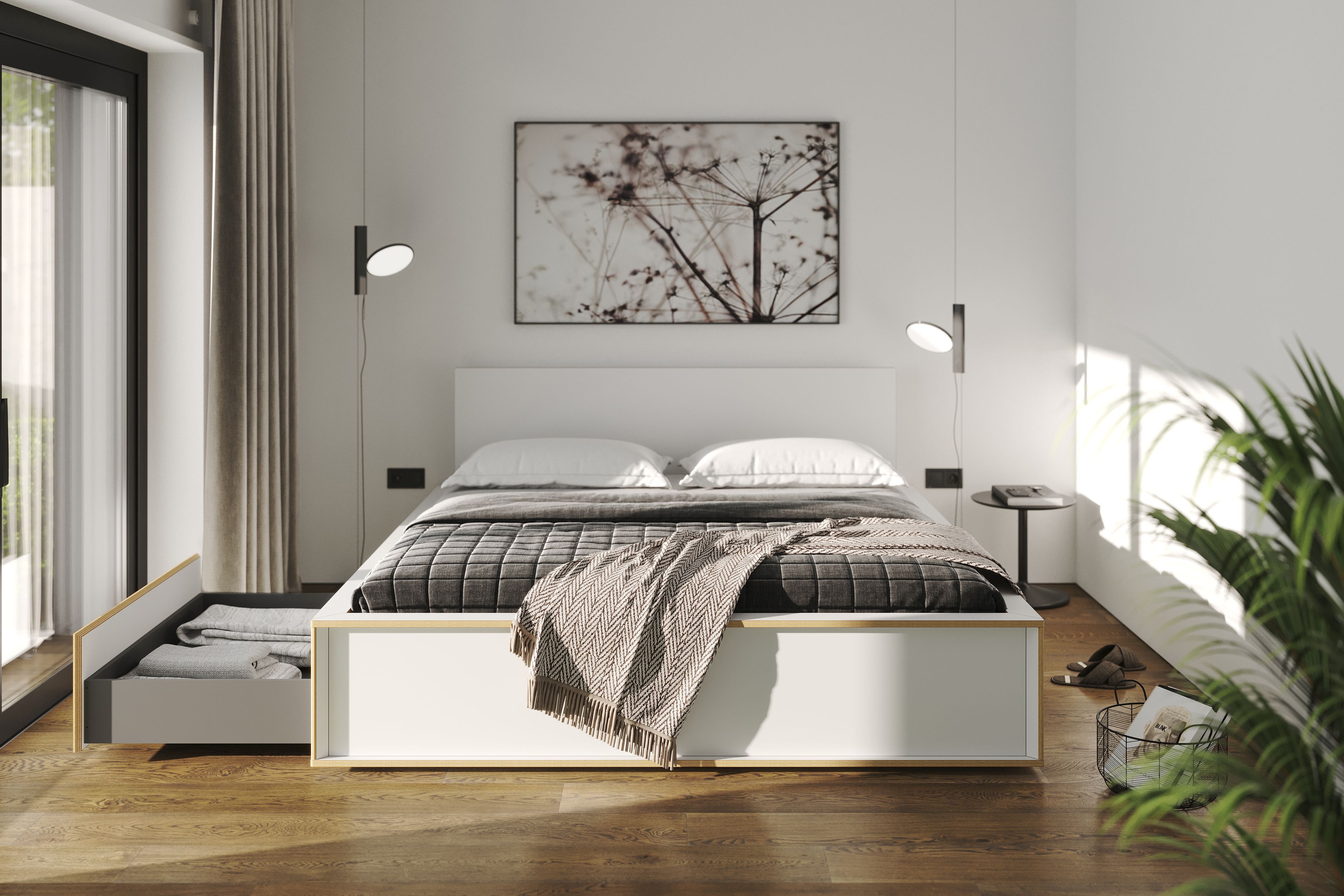 Spaze Bett von Müller Möbelwerkstätten in Weiß mit Schublade und Textilien im Schlafzimmer.