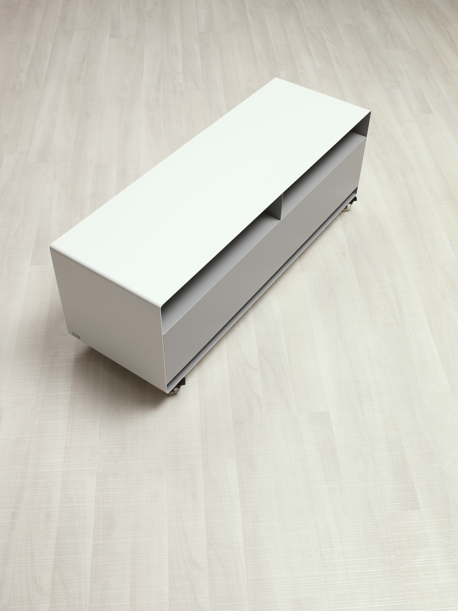 Modernes R109N Sideboard von Müller Möbelfabrikation in Weiß und Grau mit Rollen auf hellem Holzboden.