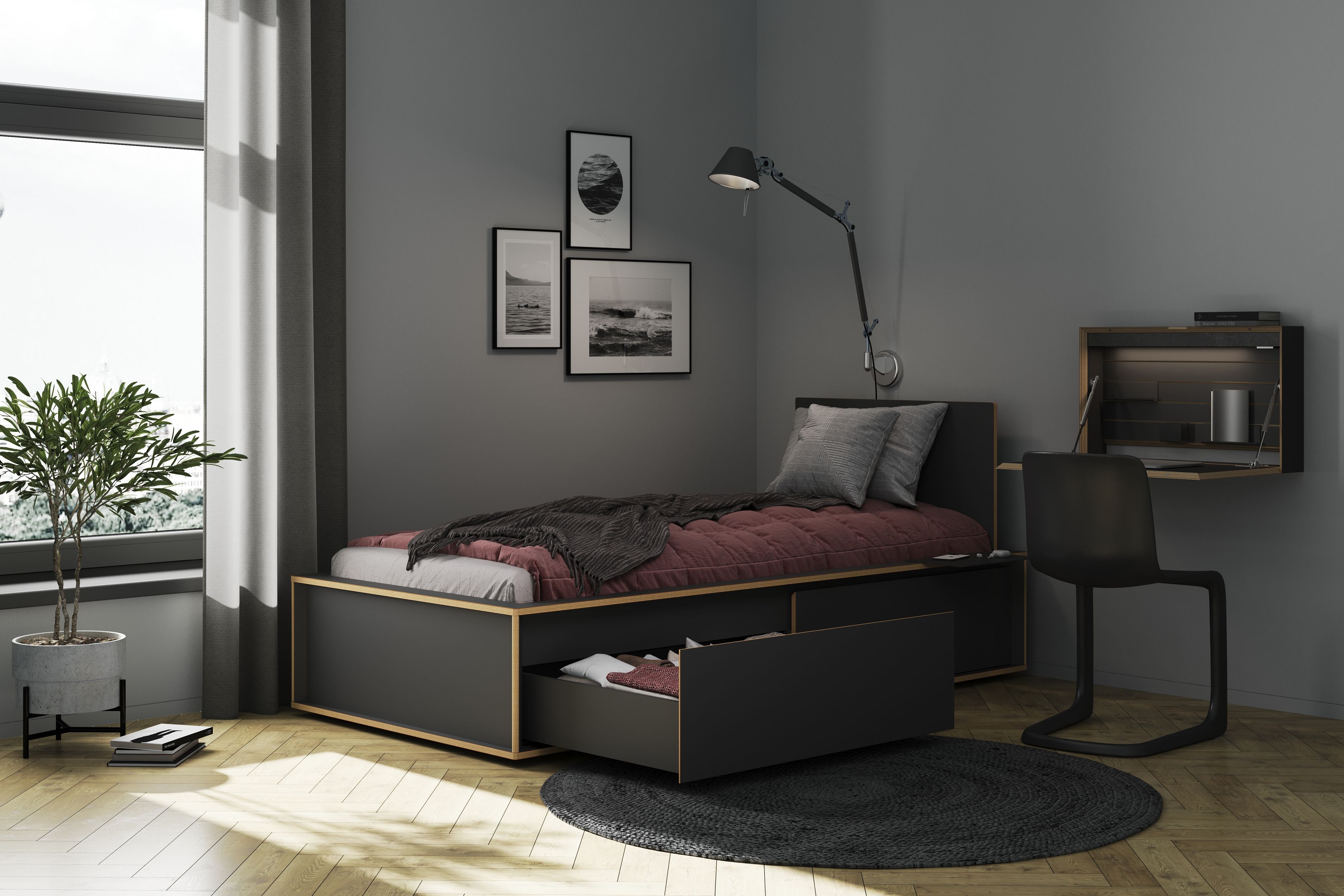 Spaze Bett von Müller Möbelwerkstätten in dunklem Holz mit Schubladen und passendem Schreibtisch.
