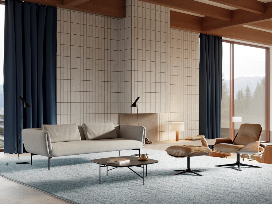 Wohnzimmer mit beigem Rei Sessel von Prostoria, Sofa, Couchtisch und braunem Ledersessel.