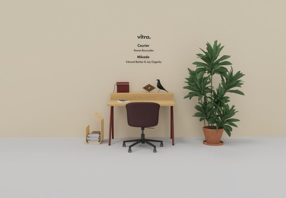 Vitra Courier Schreibtisch mit Bürostuhl, Zimmerpflanze und Accessoires in einem modern eingerichteten Arbeitszimmer.