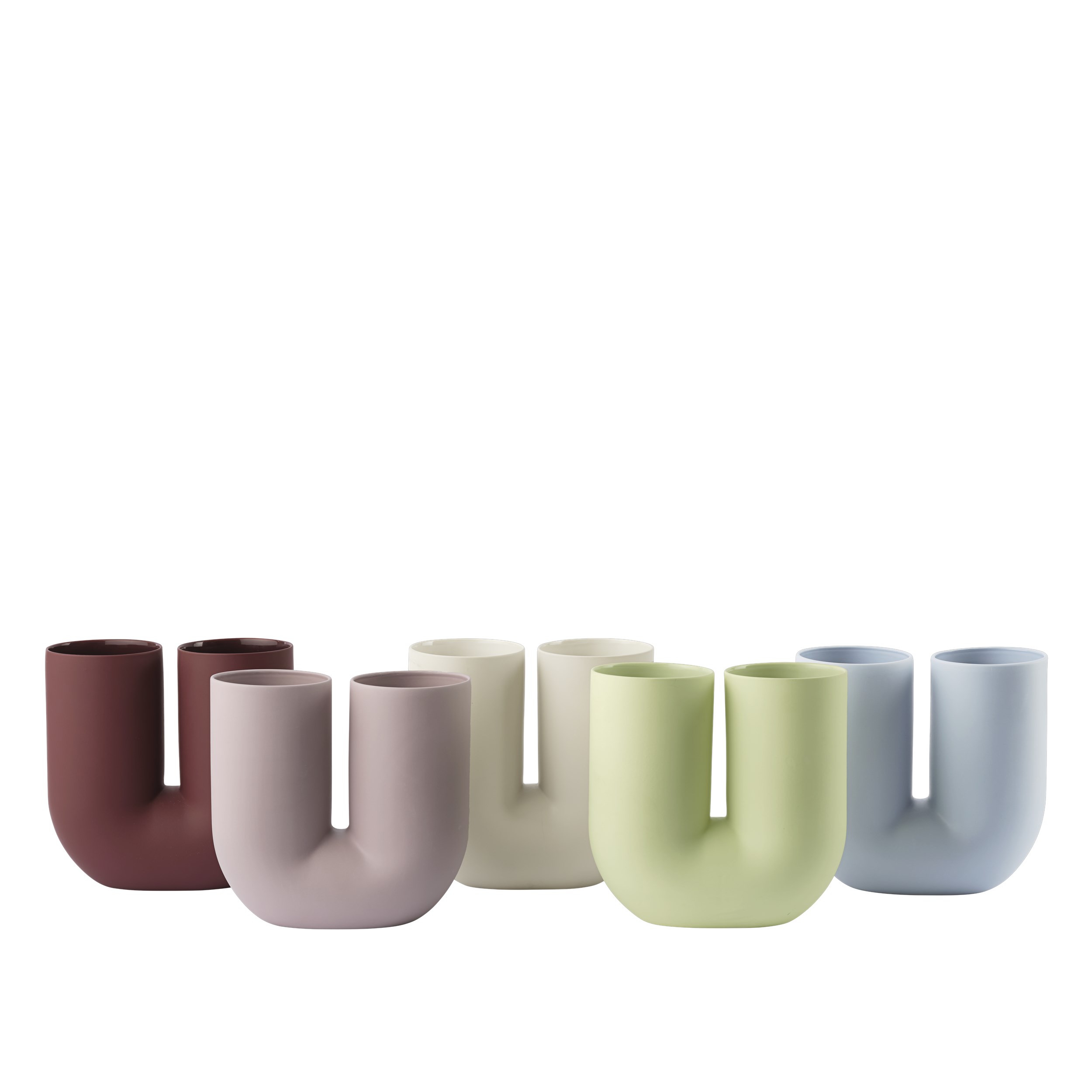 Mehrere Kink Vasen von Muuto in verschiedenen Farben, darunter die hellgrüne Kink Vase.