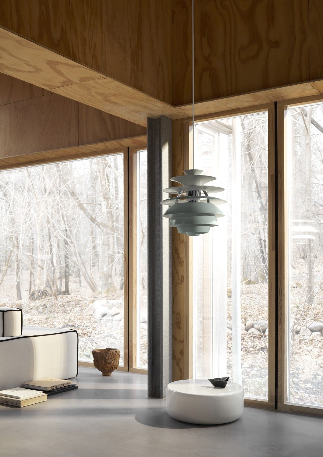 PH Snowball Pendelleuchte von Louis Poulsen in einem modernen Wohnraum mit großen Fenstern.