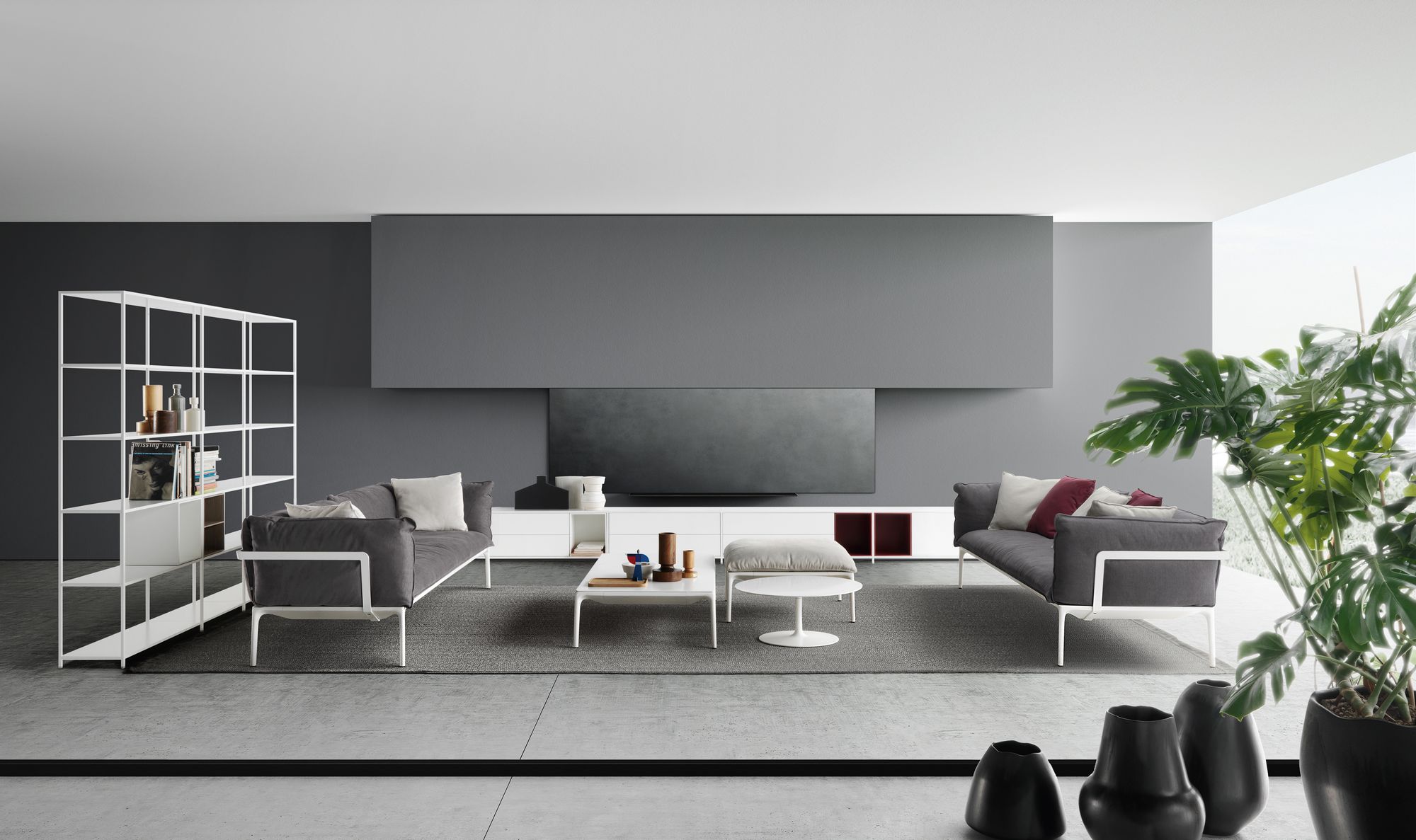 Heller Wohnraum mit grauem Sofa und weißem Flow Low Table Couchtisch von MDF Italia.