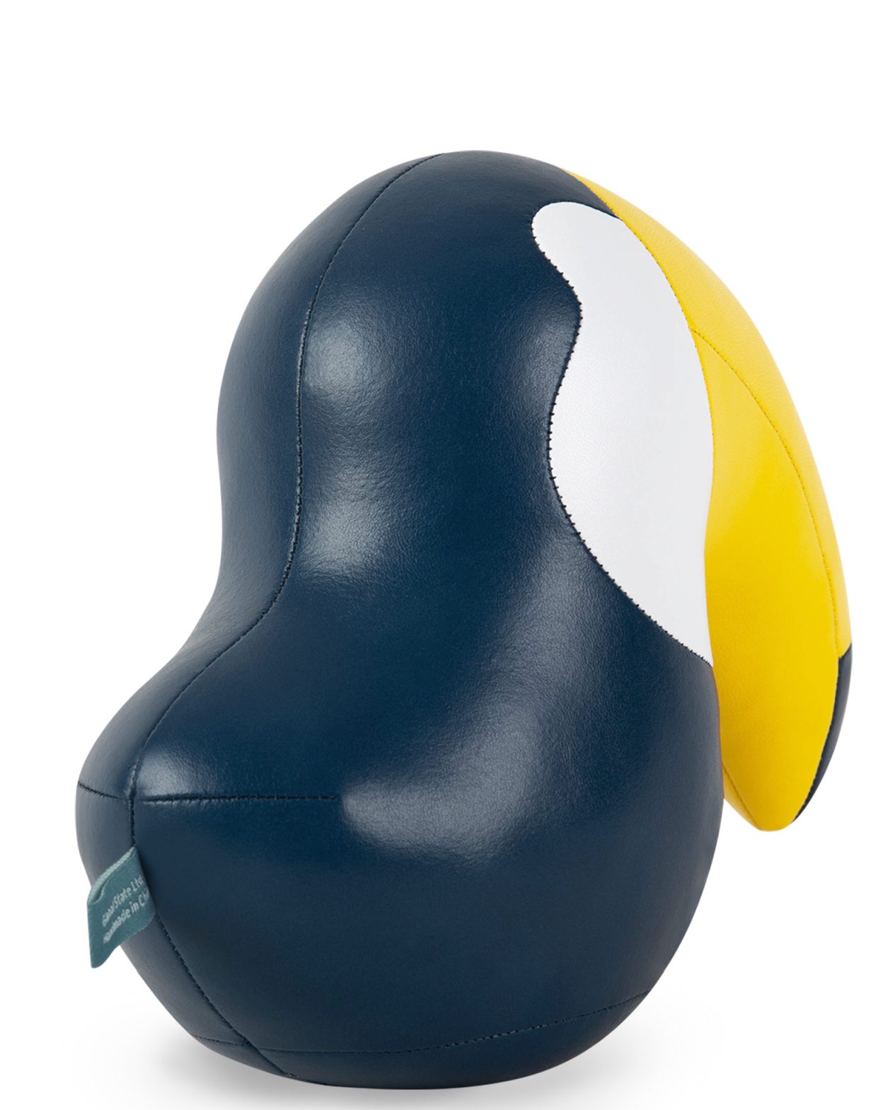Detailaufnahme der Züny Toucan Buchstütze in Mitternachtsblau und Gelb, dekoratives Wohnaccessoire.