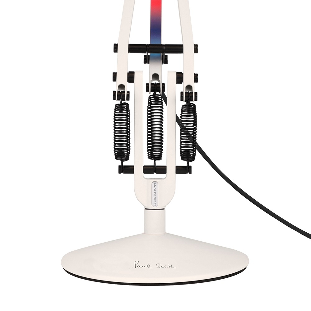 Detailaufnahme der weißen Anglepoise Type 75 Mini Paul Smith Edition Tischleuchte mit Federmechanismus.