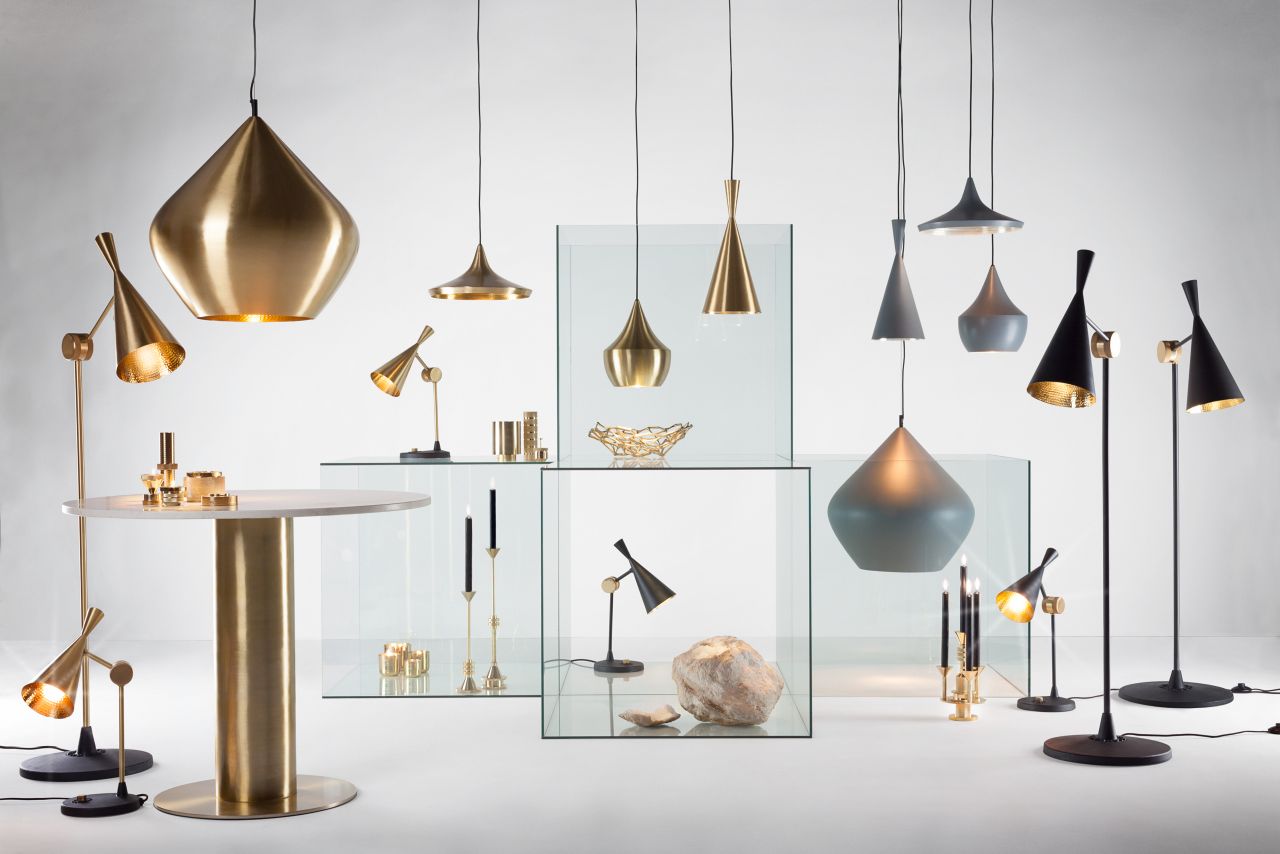 Verschiedene Tom Dixon Beat Leuchten: Pendelleuchten, Stehleuchten und Tischleuchten in Gold, Grau und Schwarz.