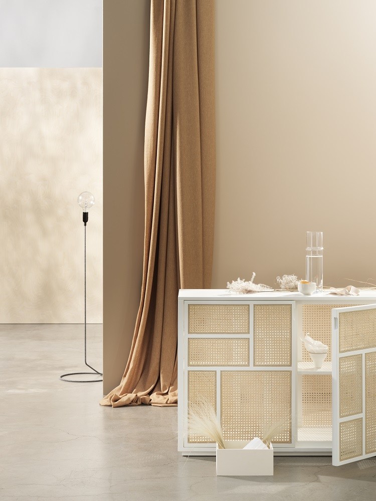 Weißes Air Sideboard von Design House Stockholm mit Rattanfronten und offener Tür.