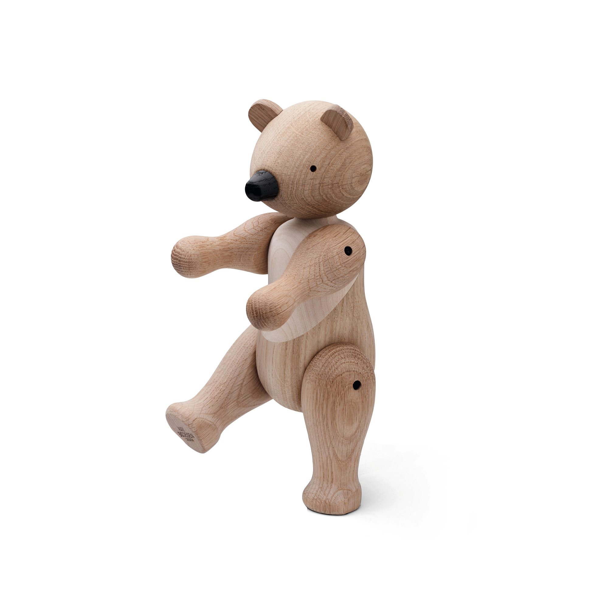 Holzfigur Bär von Kay Bojesen, mittelgroß, aus hellem Holz, stehend auf einem Bein.
