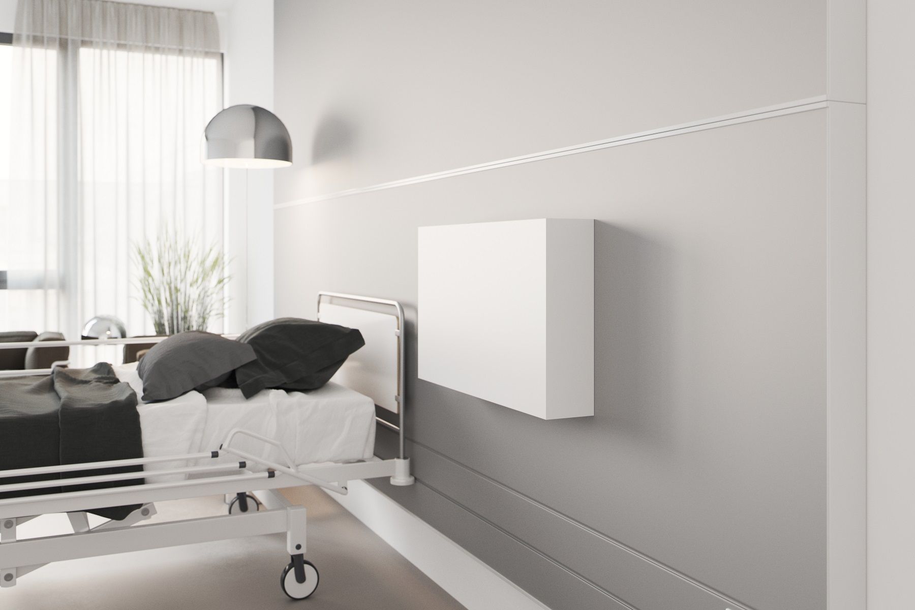 Weißer Flatbox Sekretär von Müller Möbelwerkstätten neben einem Krankenhausbett an der Wand.
