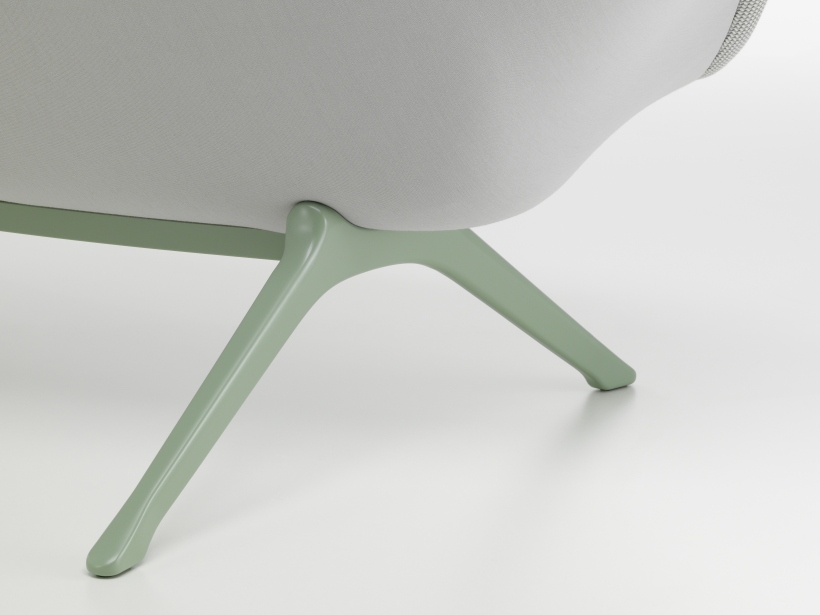 Detailaufnahme des Abalon Sofas von Vitra, das die hellgrünen Beine und die Polsterung zeigt.