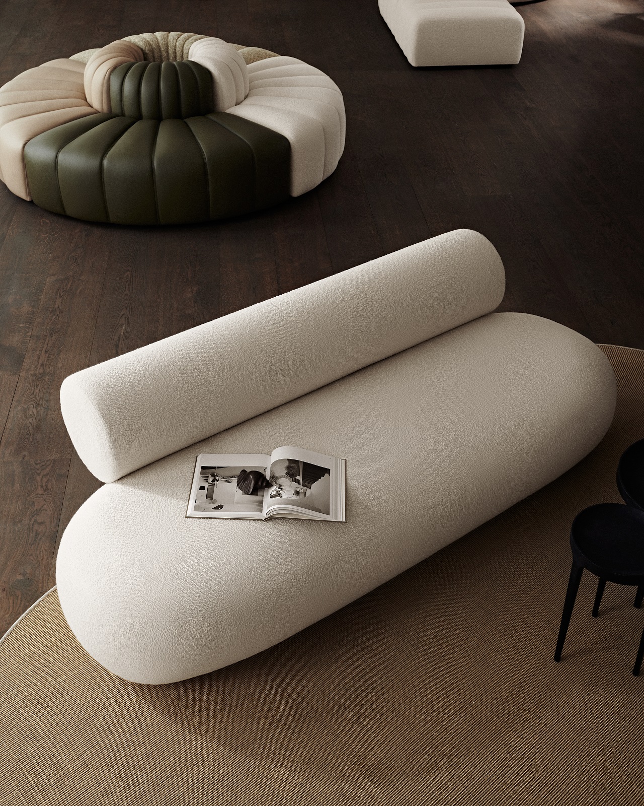 Beige Hippo Sofa von Norr11 aus Holz mit runden Kissen und offenem Buch im Wohnzimmer.