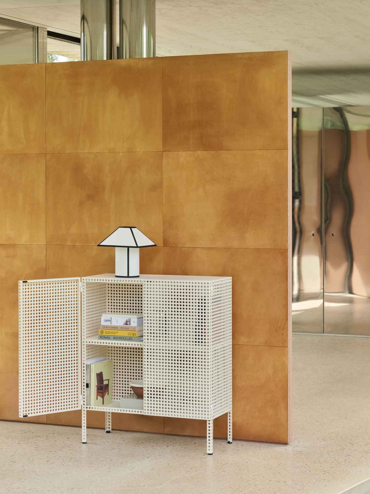 Weißes Perforated Cabinet Sideboard von Hay mit offener Tür und Lampe auf der Oberseite.