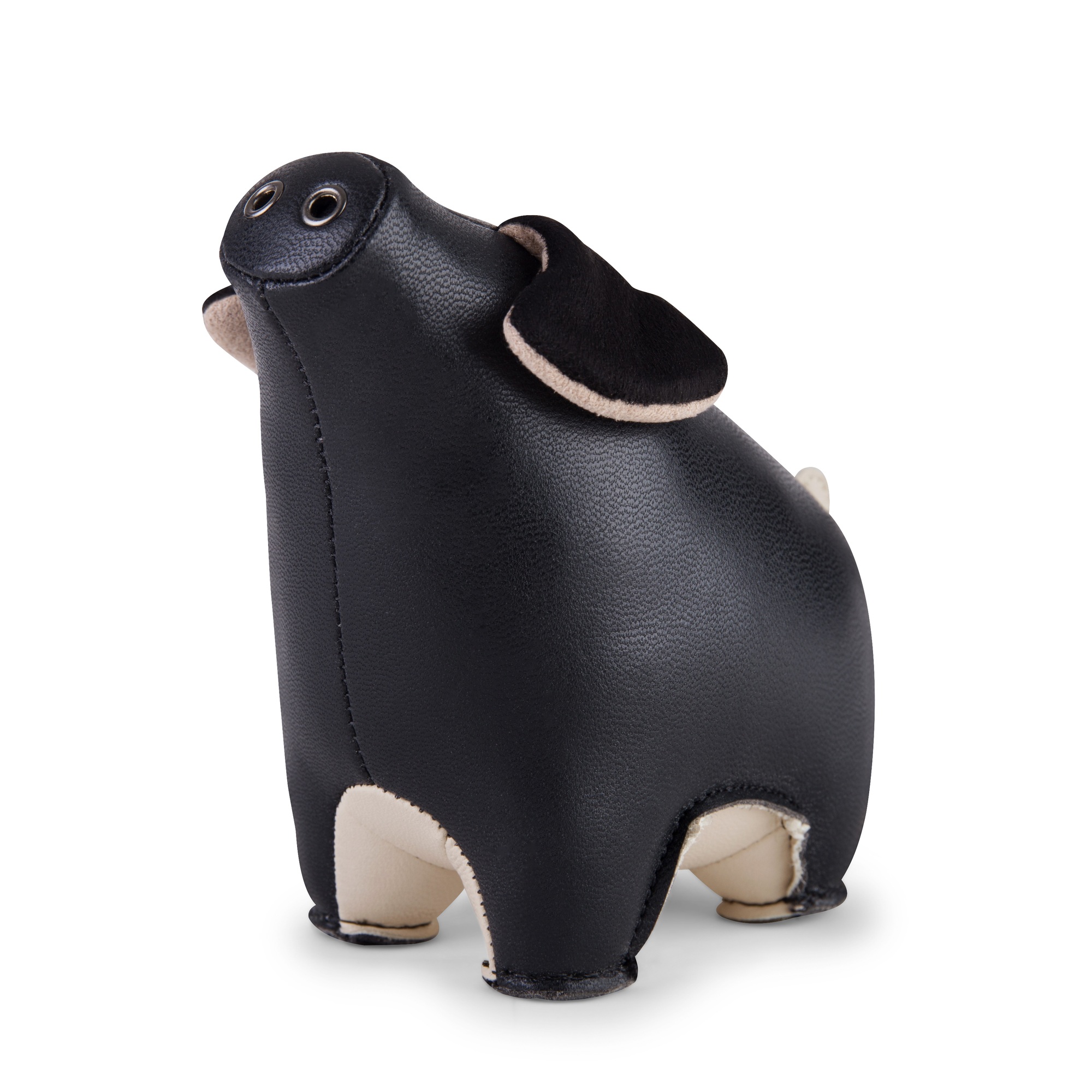 Briefbeschwerer Schwein Diya von Züny, schwarz-weizenfarbenes Kunstleder, dekoratives Accessoire und praktischer Schreibtischhelfer.