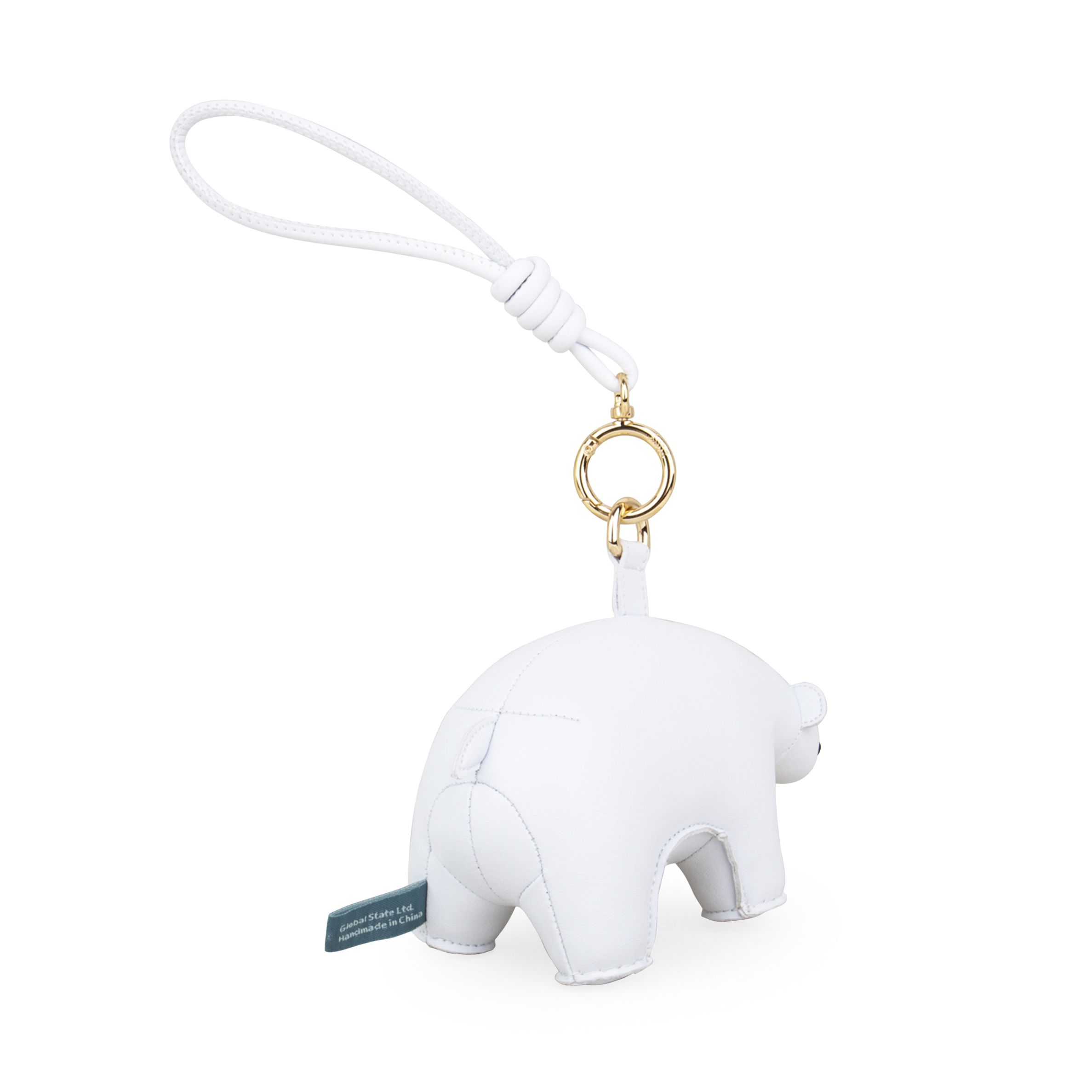 Detailaufnahme des Züny Eisbär Taschenanhängers: Weißes Kunstleder, goldfarbener Ring und Schlaufe. Dekorativer Schlüsselanhänger für Taschen.