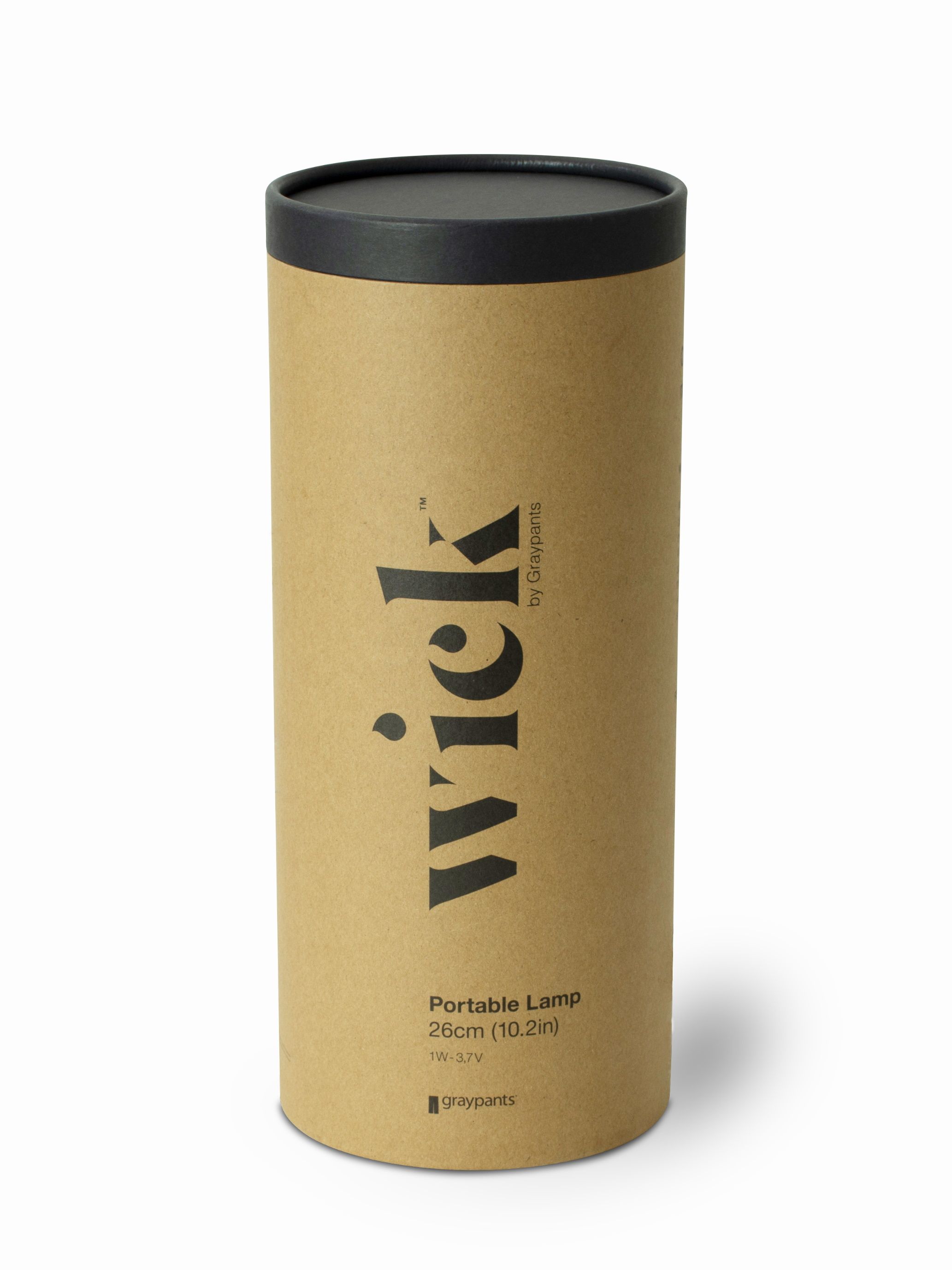 Verpackung der Wick Portable Akkuleuchte von Graypants, moderne Tischleuchte im zylindrischen Karton.