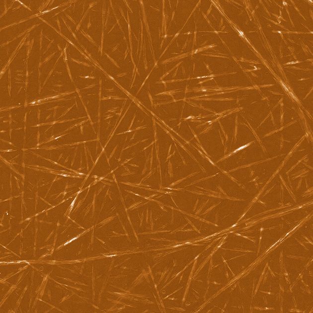 Nahaufnahme von Cellulose-Nanokristallen (CNC) auf braunem Hintergrund, ideal für wissenschaftliche oder industrielle Anwendungen.