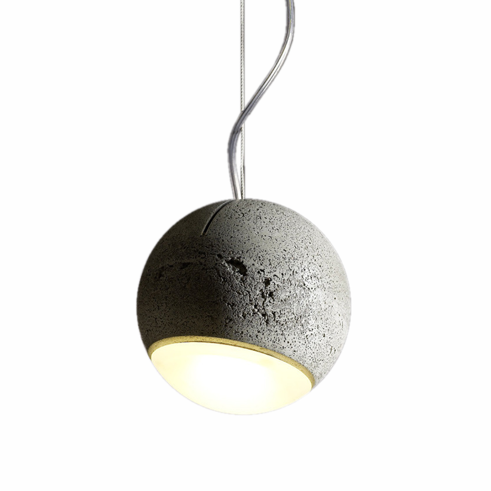 Trabant Pendelleuchte von Tecnolumen: Runde Hängelampe aus grauem Beton mit warmweißem Lichtschein.