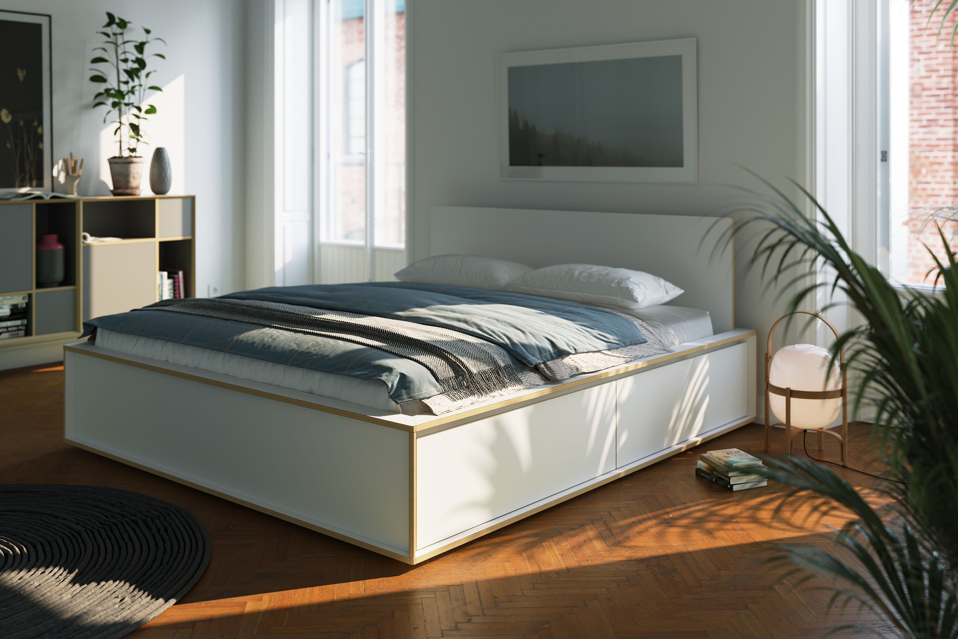 Helles Schlafzimmer mit Spaze Bett von Müller Möbelwerkstätten, blauer Bettwäsche und Holzboden für modernes Wohnen.