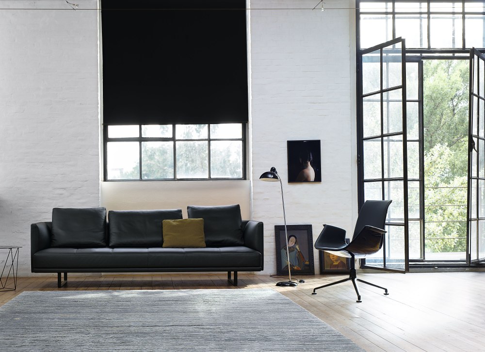 FK 6725-3G Sessel von Walter Knoll in schwarzem Leder in modernem Wohnzimmer.
