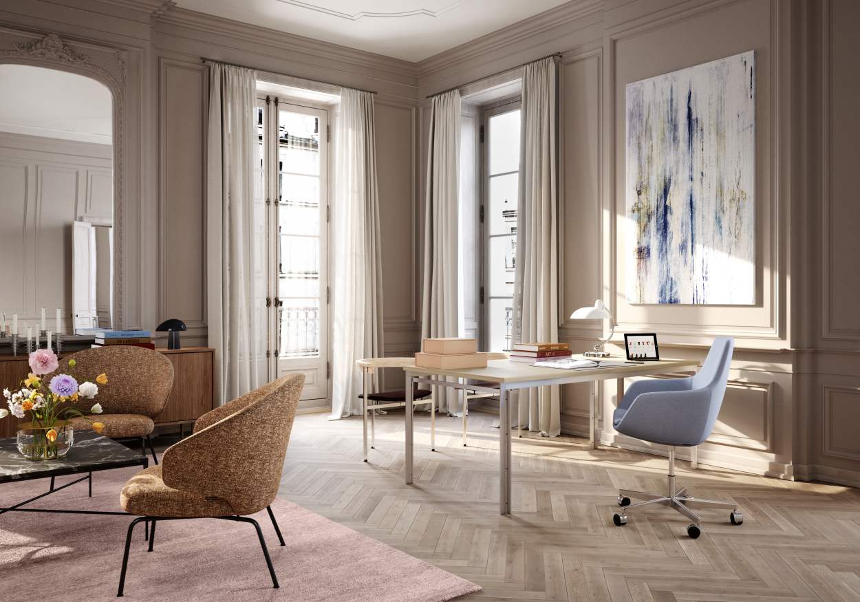 Heller Wohnraum mit Fritz Hansen PK51 Esstisch, Stühlen, Teppich und Kunstwerk an der Wand.