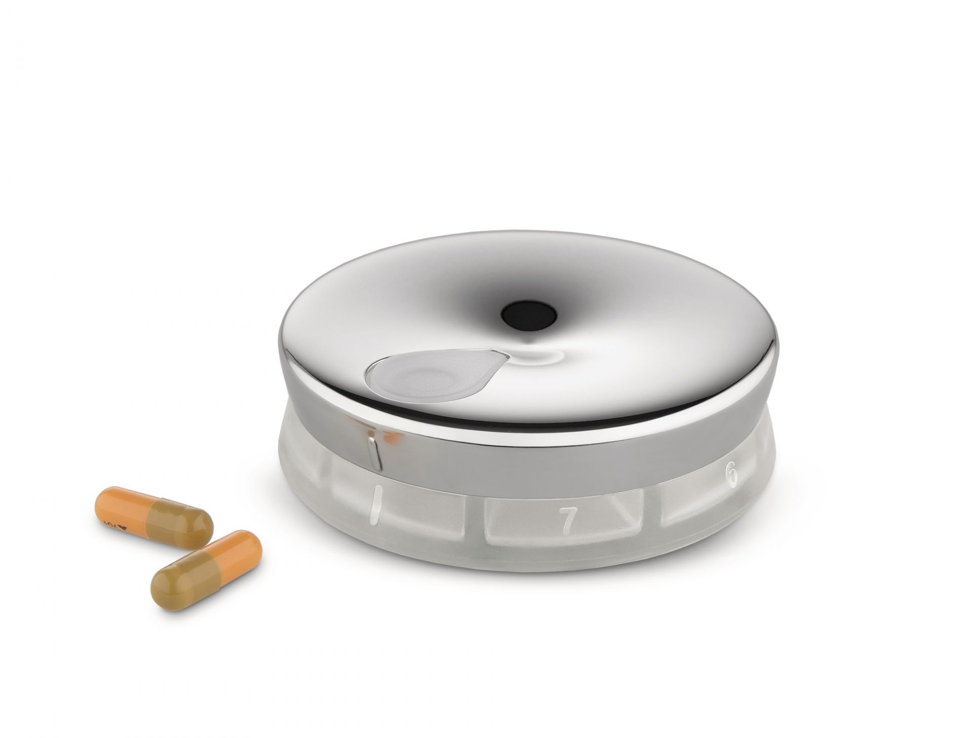 Alessi Pillendose BM08 YoYo, silberfarben, mit zwei Kapseln auf weißem Hintergrund.