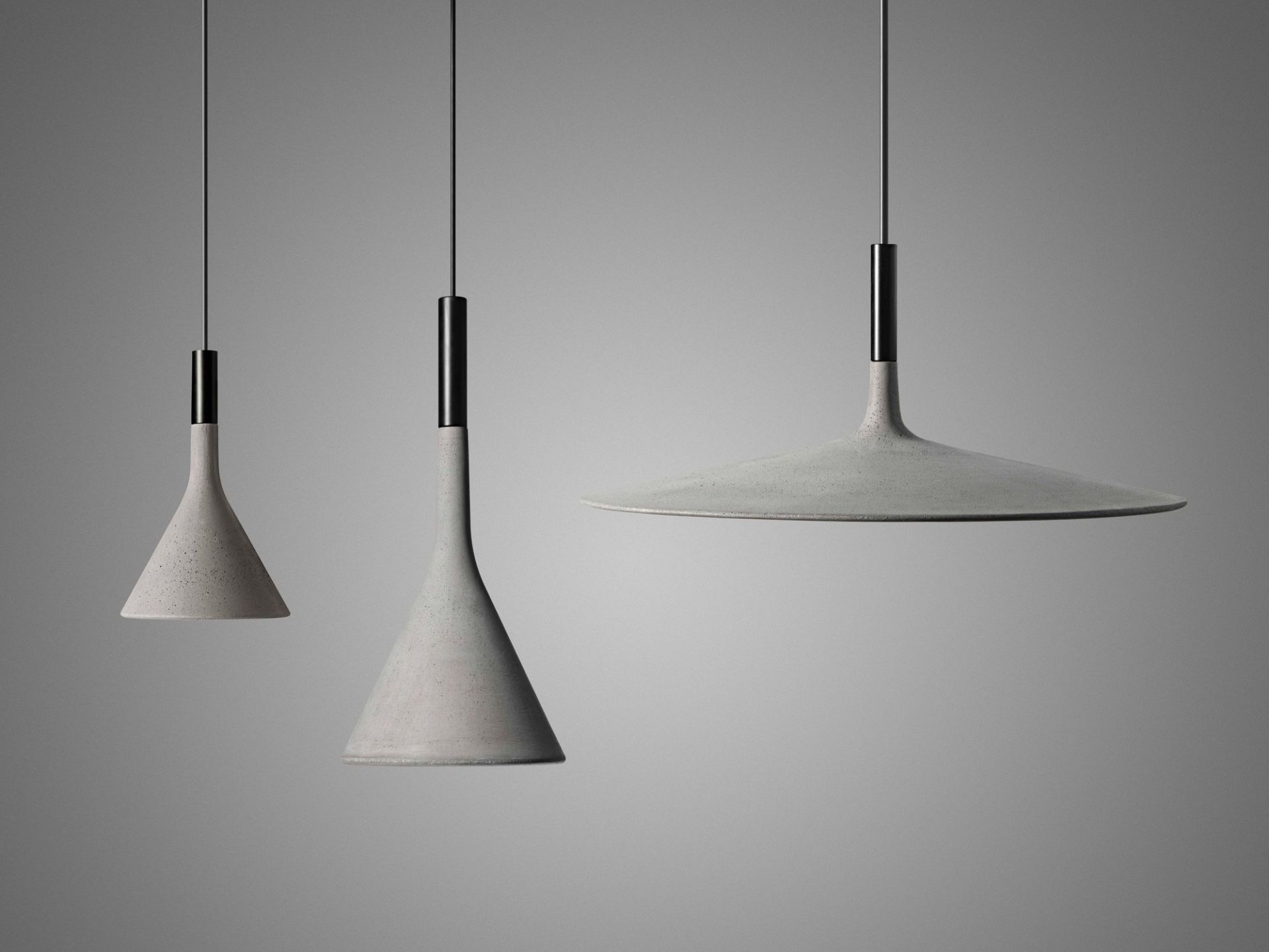 Drei graue Aplomb Pendelleuchten von Foscarini, moderne LED-Hängelampen aus Beton.