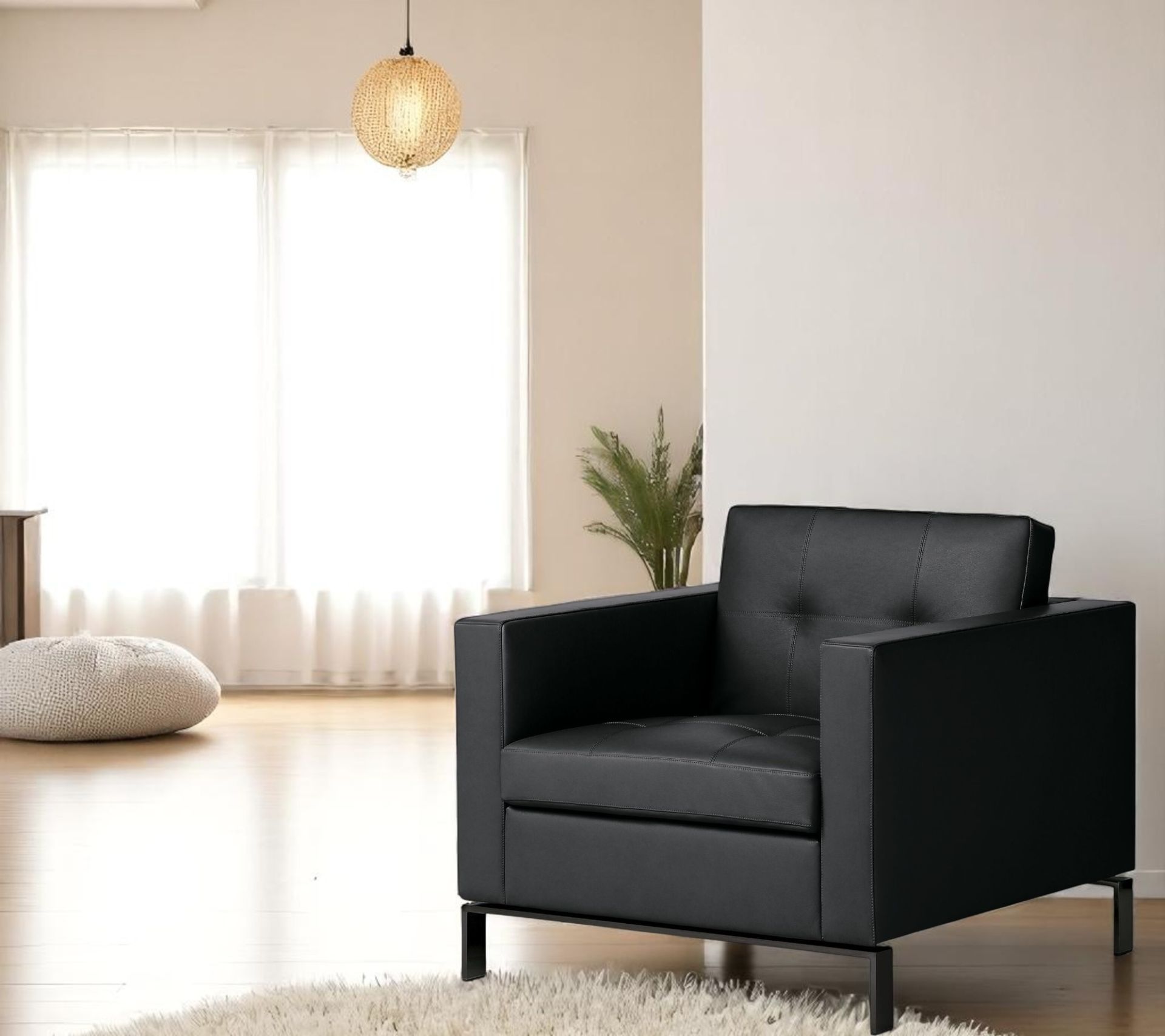 Schwarzer 502 Foster Sessel von Walter Knoll im modernen Wohnzimmer mit Teppich und Tageslicht.