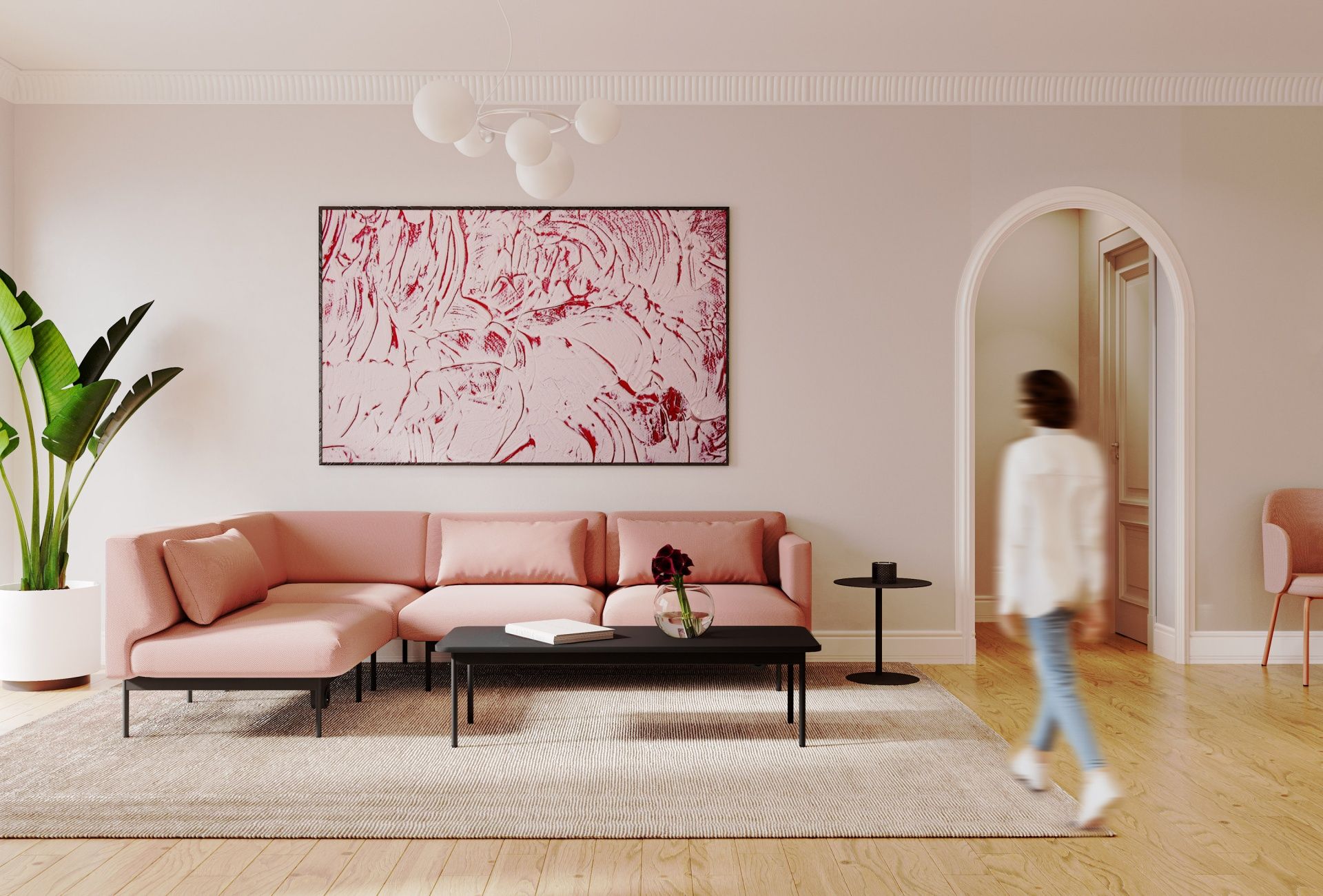 Modernes Wohnzimmer mit rosa fora FR 422 Sofa 2-Sitzer von Bejot, schwarzem Couchtisch und Kunst an der Wand.
